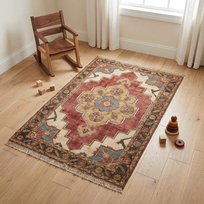 Hand knotted wool floral medallion area rug with traditional Indo-Persian design in rich brick red, ivory, and gold tones