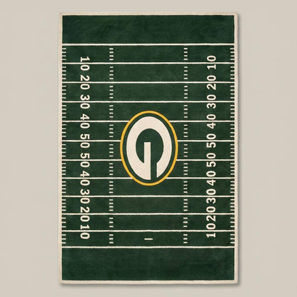 Detailed view of football field layout rug featuring yard line markings and centered emblem design.