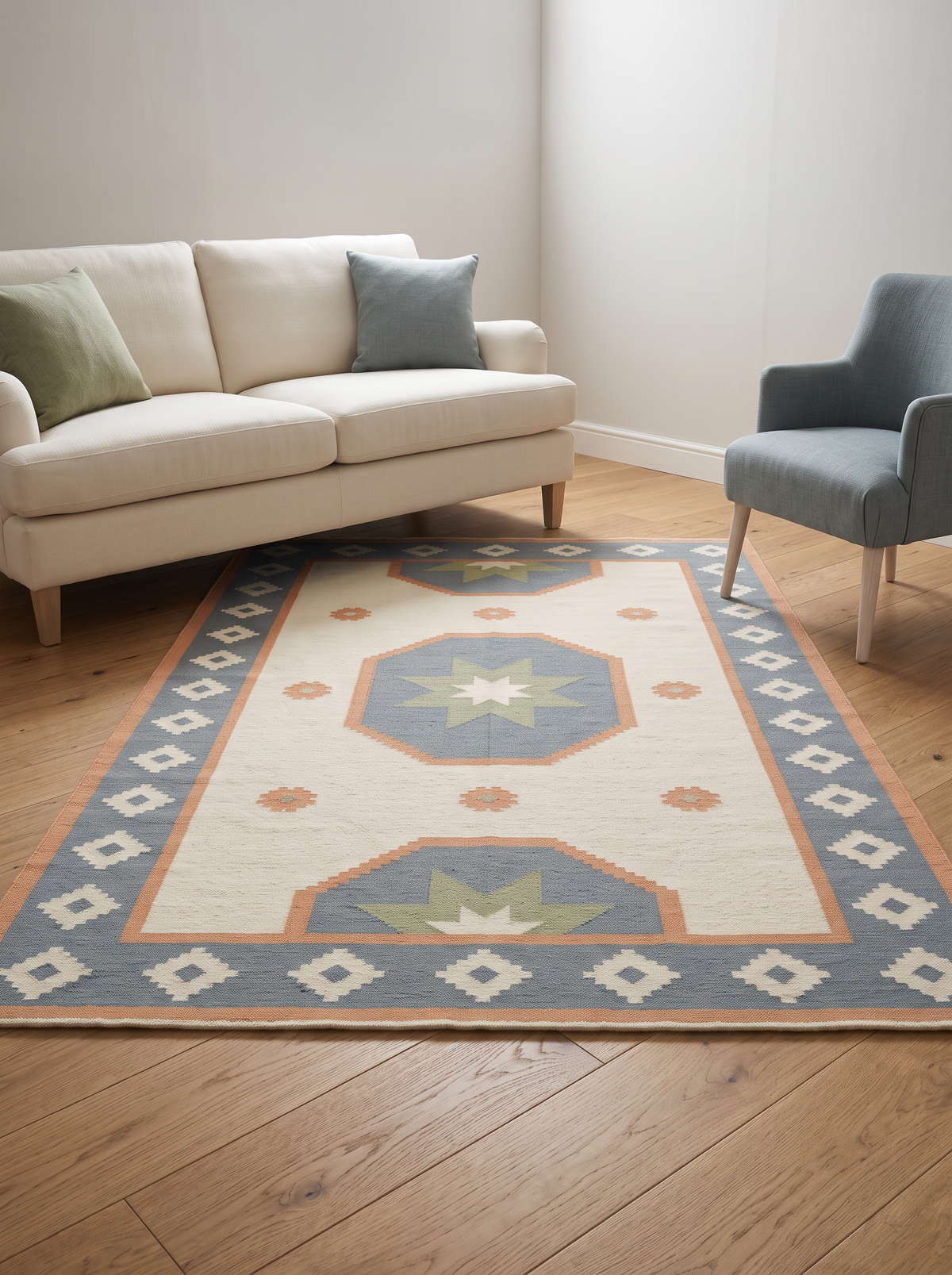 Southwestern Flatweave Wool Rug in ivory with dusty blue, peach and sage star medallions and a stepped diamond border.