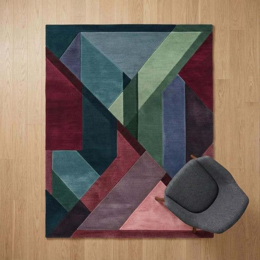 Geometric Art Deco area rug with burgundy, teal, and green color blocks in bold shapes