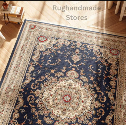 Hand knotted Oushak rug with muted gray floral wool design, traditional Turkish craftsmanship in soft peachy orange, gray-blue, green, cream, and black hues, ideal for living room or bedroom.