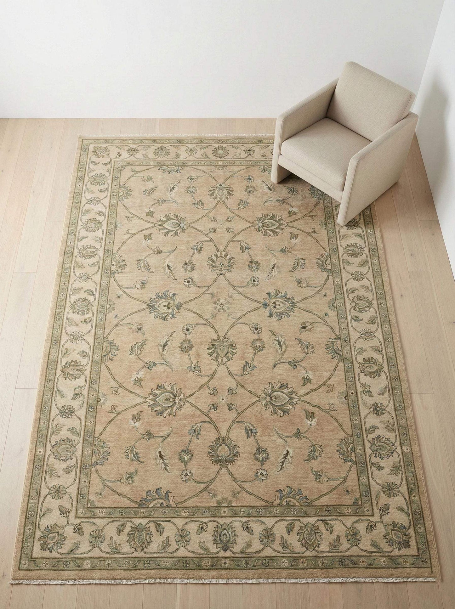 Hand-Knotted Oushak wool rug in muted sage green with floral pattern and natural wool texture