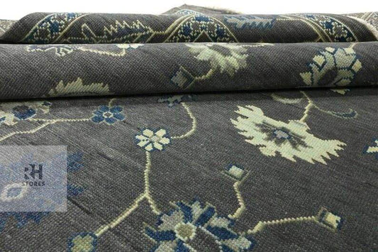 Hand knotted Oushak wool rug with traditional floral design in muted gray for 8x10 area