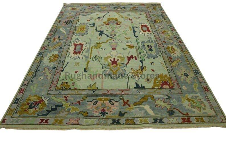 Hand-knotted Oushak wool rug with vintage Turkish floral design in blueish green and beige colors, 8x10 area rug