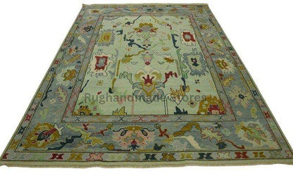 Hand-knotted Oushak wool rug with vintage Turkish floral design in blueish green and beige colors, 8x10 area rug