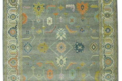 Hand-knotted Oushak wool rug with vintage Turkish floral design in green and blueish tones for living room decor