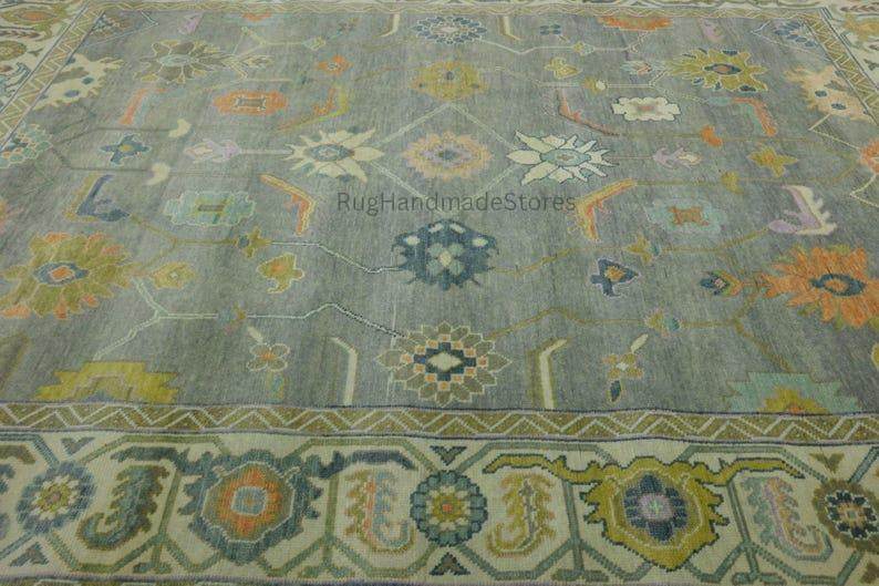 Hand-knotted Oushak wool rug with vintage Turkish floral design in green and blueish-green tones for living room decor
