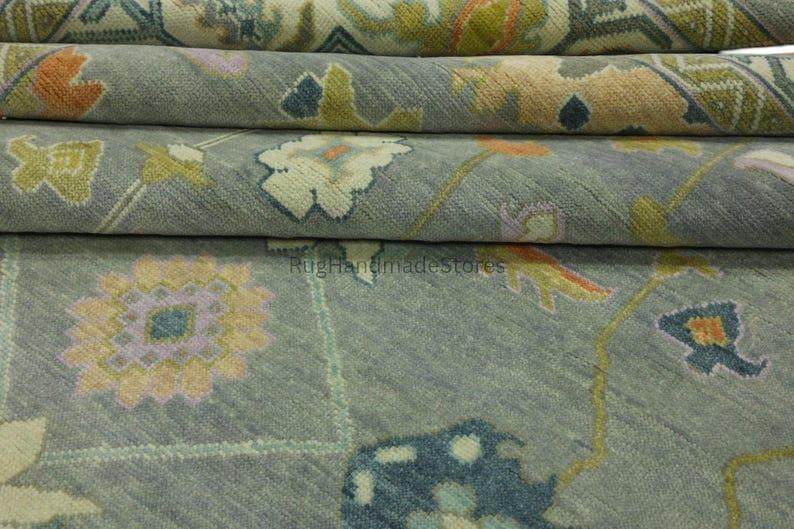 Hand-knotted Oushak wool rug with vintage Turkish floral design in green and blueish tones for living room decor