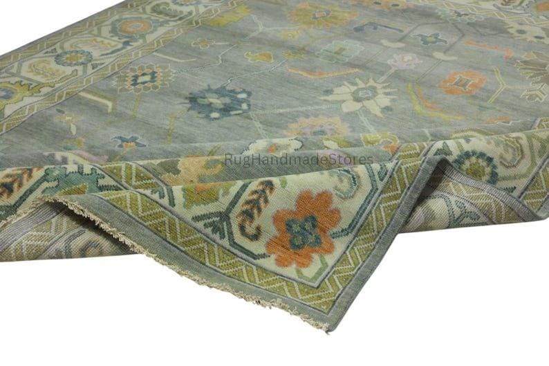 Hand-knotted Oushak wool rug with vintage Turkish floral design in green and blue-green tones for living room decor
