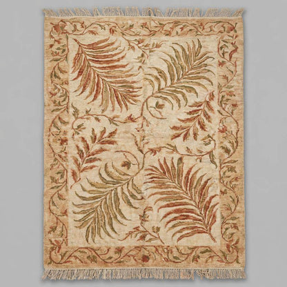 Detailed view of the muted earth tone palette featuring mossy green, rust orange, and sandy beige botanical motifs.