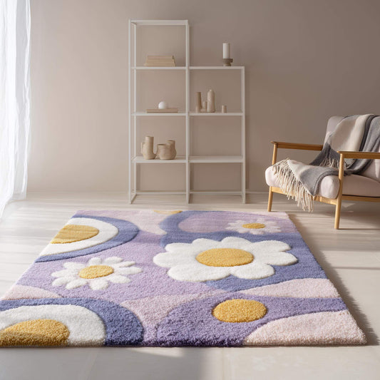 Hand tufted rug with pastel lavender flower design and high pile texture for boho nursery and living room decor