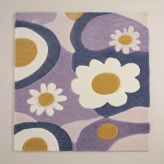 Hand tufted rug with pastel lavender flower design and high pile texture for boho nursery or cozy living room