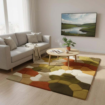Hand tufted pebble rug with soft pebble texture in olive green and burnt orange, eco-friendly wool, Scandinavian decor style.