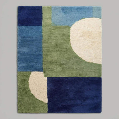 Hand tufted wool rug with mid-century modern blue and green geometric design