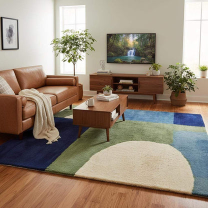Hand tufted wool rug with blue and green mid-century geometric design