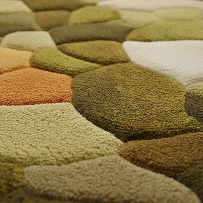 Hand tufted pebble rug in moss green and burnt orange with textured high pile for boho mid-century decor