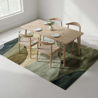 Hand tufted wool rug with abstract landscape design in green and earth tones for modern living spaces