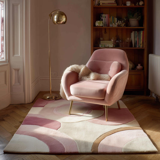 Hand-tufted pastel pink wool rug with art deco geometric design and cozy texture