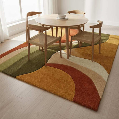 6x8 hand-tufted wool rug with retro abstract sculptural organic curves in warm golden yellow, rust orange, olive green, and cream colors