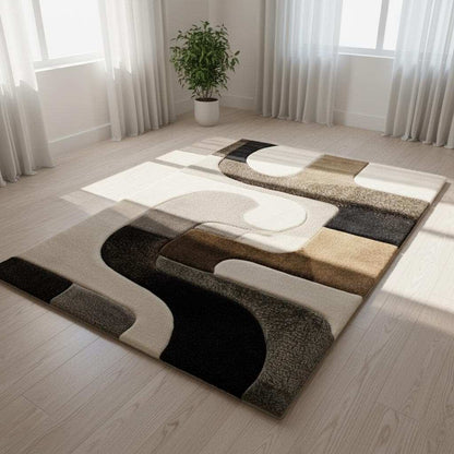 Hand tufted wool rug with abstract geometric black and ivory design and high-low texture