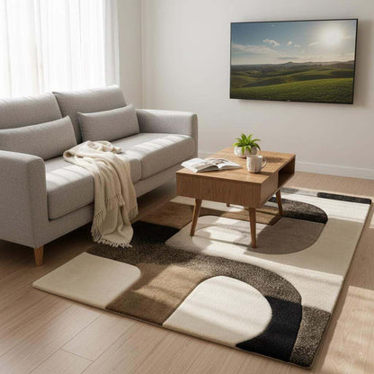 Hand tufted wool rug with abstract black geometric design on ivory background and high-low texture