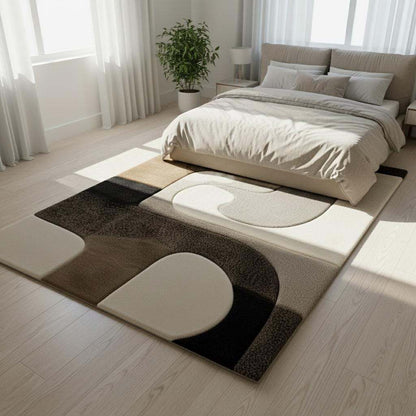 Hand tufted wool rug with abstract black geometric design on ivory background, plush high-low texture, and custom size options