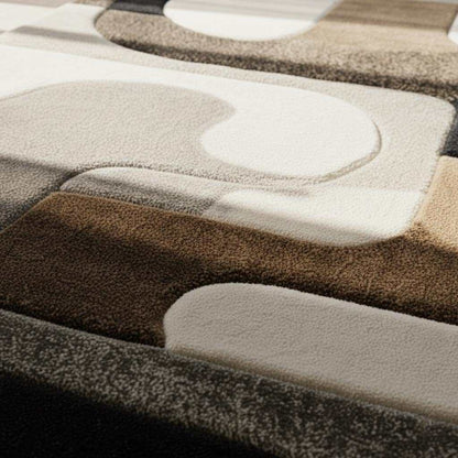 Hand tufted wool rug with abstract black and ivory geometric design and high-low texture