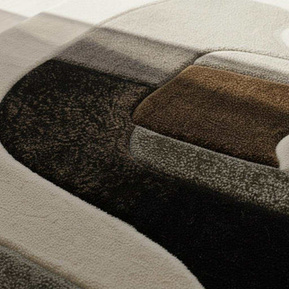 Hand tufted wool rug with abstract geometric black and ivory design and plush textured pile
