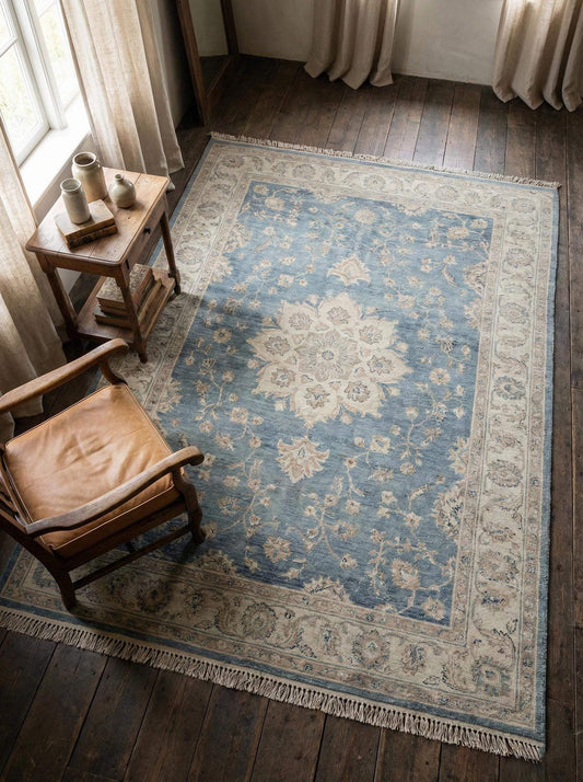 Hand knotted blue Oushak wool area rug with traditional design for living room decor