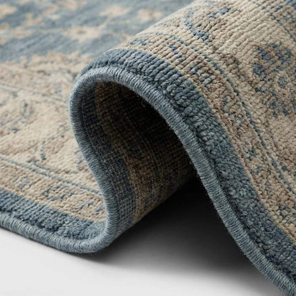 Close-up of hand knotted wool pile showing individual knots and soft natural fiber texture