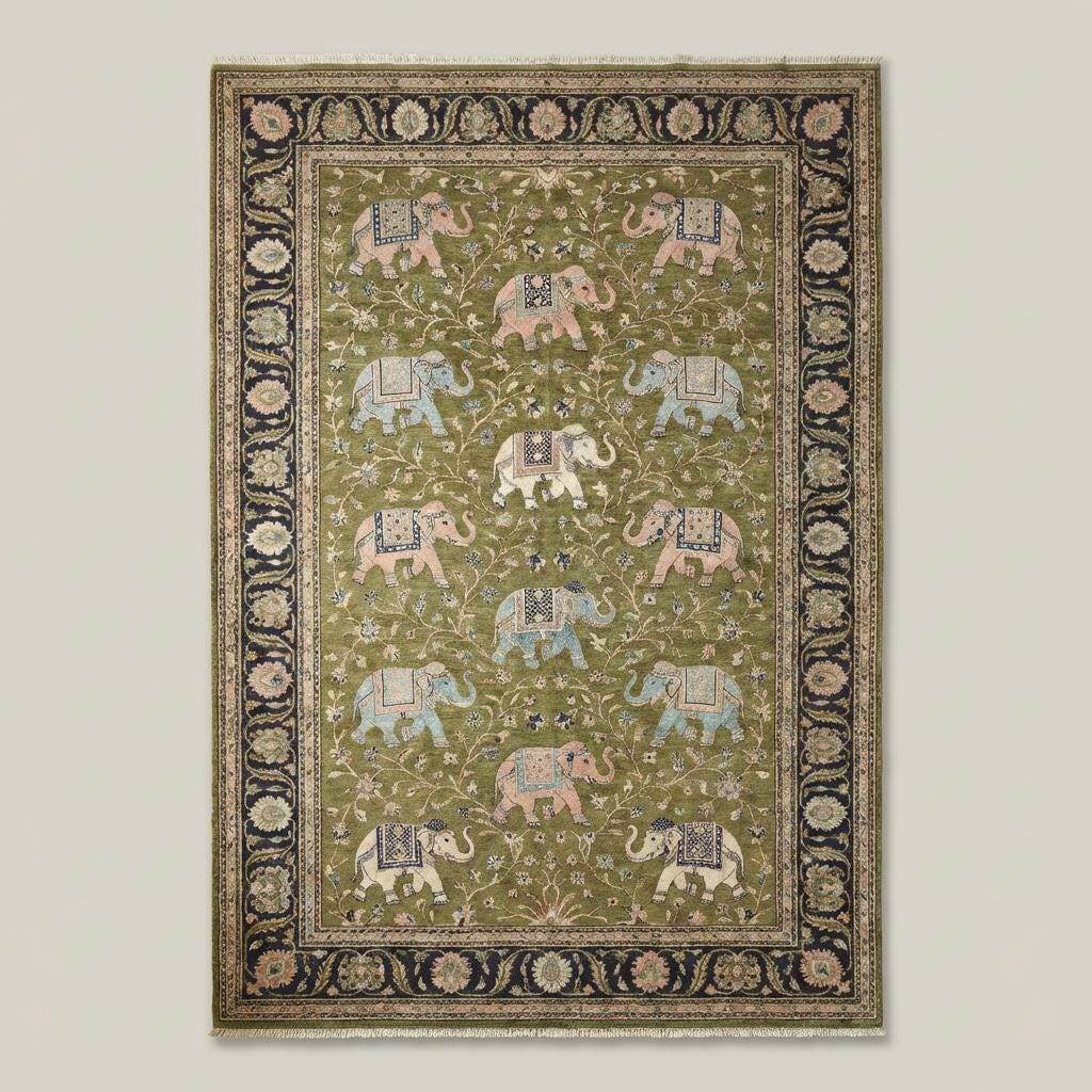 Traditional elephant pattern rug with navy ornamental border on wooden floor interior