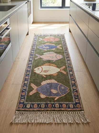 Traditional hand knotted wool carpet featuring navy floral border and multicolored fish artwork inspired by ocean and seaside living. __etsy:8125173461