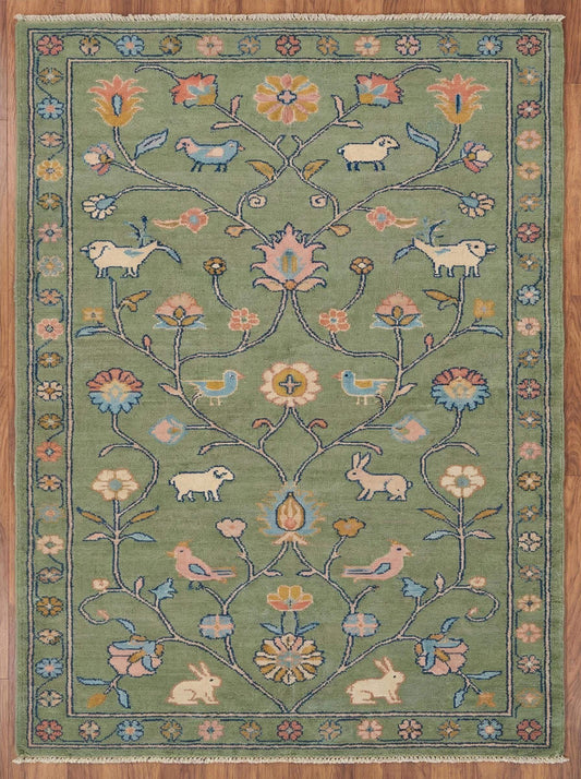Hand knotted floral area rug with sage green wool and animal motifs for traditional living room decor