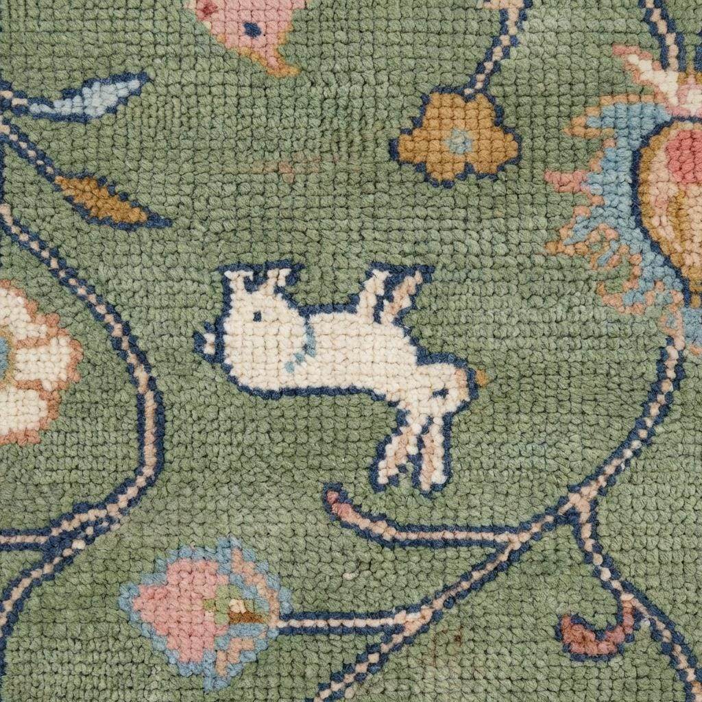 Close-up of hand knotted wool fibers showing knot-by-knot weave, medium cut pile density, artisan craftsmanship detail