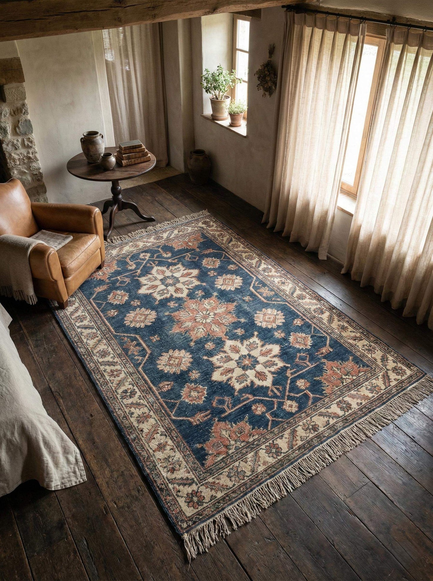 Hand knotted Oushak wool area rug with blue floral medallion pattern in living room setting __etsy:7663824798