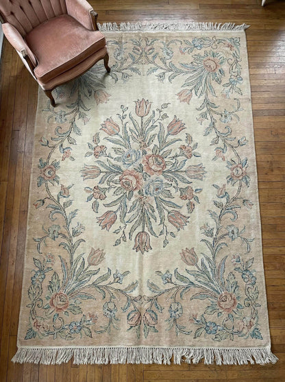 Hand knotted floral wool area rug with ivory Persian design and blush sage accents