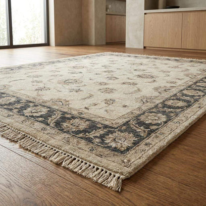 Elegant Oushak inspired hand knotted rug styled in bright modern interior