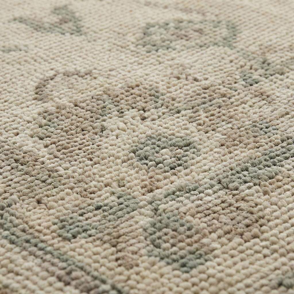 Close up of hand knotted wool rug showing low pile texture and individual knot structure