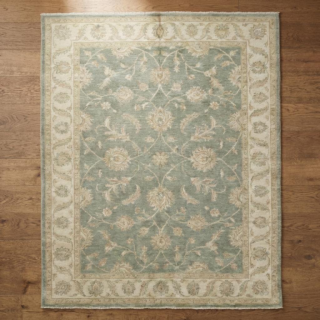 Hand knotted Oushak area rug in sage green wool with floral design