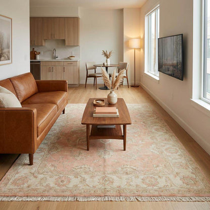 Rectangular hand knotted peach area rug designed for living room, nursery, or feminine interior styling.