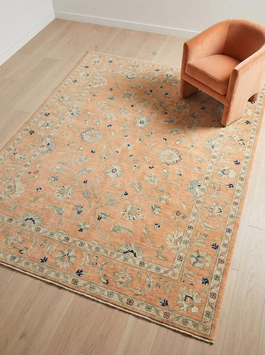 Hand knotted Oushak rug in apricot peach with muted Turkish floral design for vintage living room and soft pastel bedroom decor