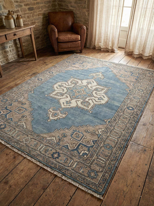 Hand knotted Oushak rug in vintage blue wool for living room with durable artisan craftsmanship