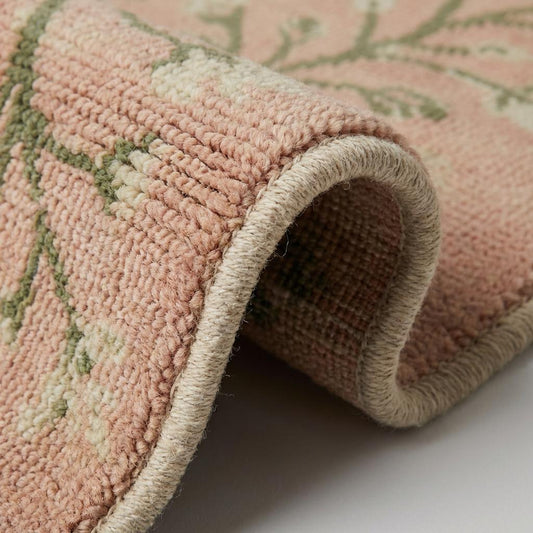 Close up of hand knotted wool rug showing dense knot structure and natural wool fibers