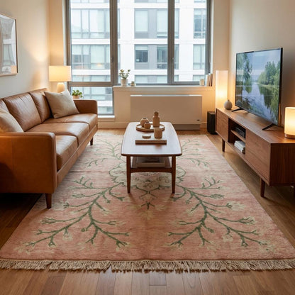 Artisan hand knotted floral rug with cotton fringe and muted vintage color palette