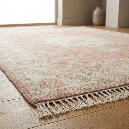 Hand knotted Oushak rug in blush pink with ivory floral medallion, soft wool area rug for living room and bedroom