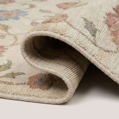 Close-up texture of hand knotted wool rug showing dense knot structure, soft pile, floral detailing and artisan weave __etsy:7950283590