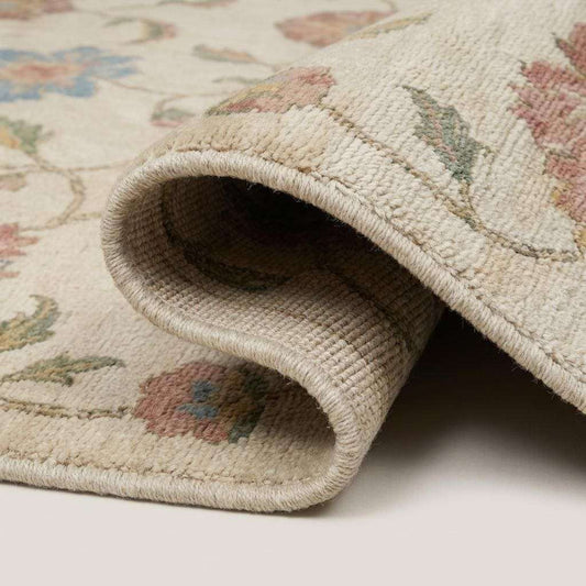 Close-up texture of hand knotted wool rug showing dense knot structure, soft pile, floral detailing and artisan weave __etsy:7950283590
