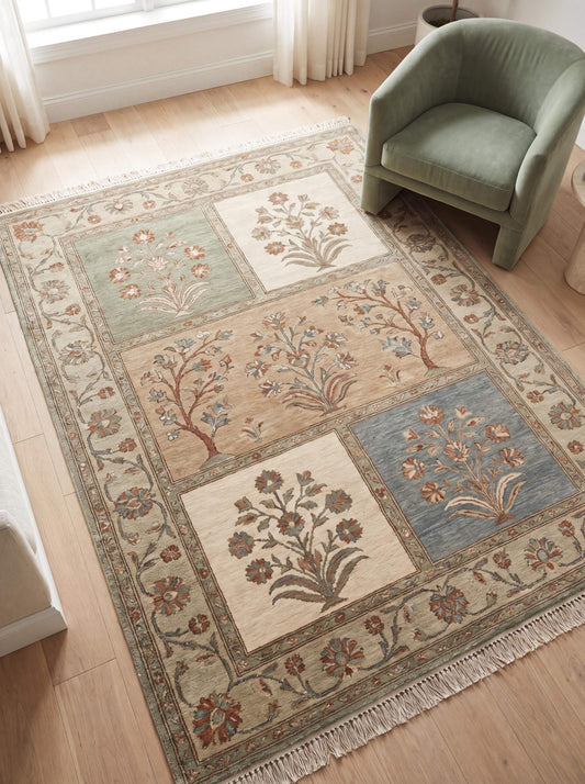 Hand knotted Oushak rug with floral panel garden design in soft beige green and blue tones placed in a modern living room __etsy:7917718838