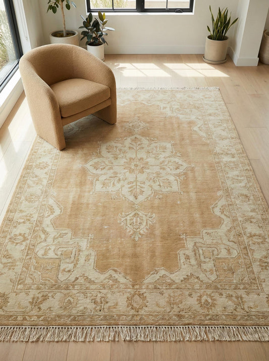 Hand knotted Oushak rug with neutral beige vintage medallion design and natural wool texture