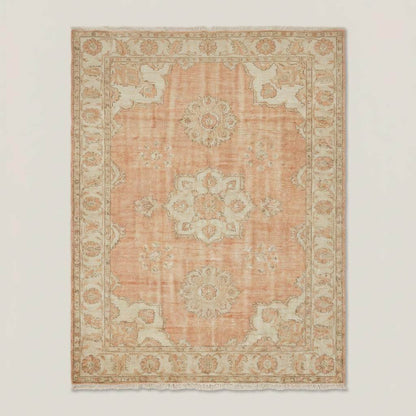 Hand knotted Oushak rug with peach floral medallion and vintage style design